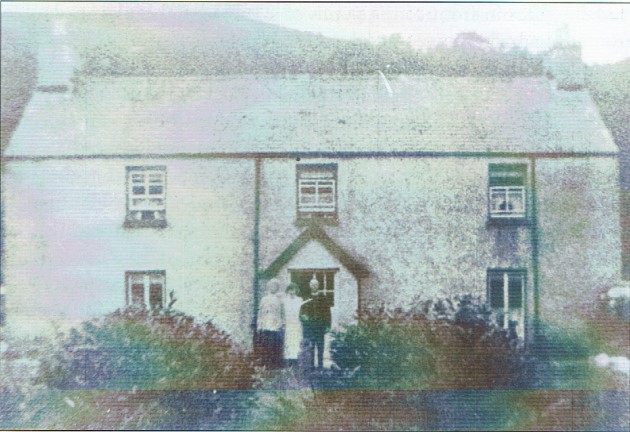 The rectory in the early '30s with the Rev. Tywyn Jones accompanied by his wife and daughter.